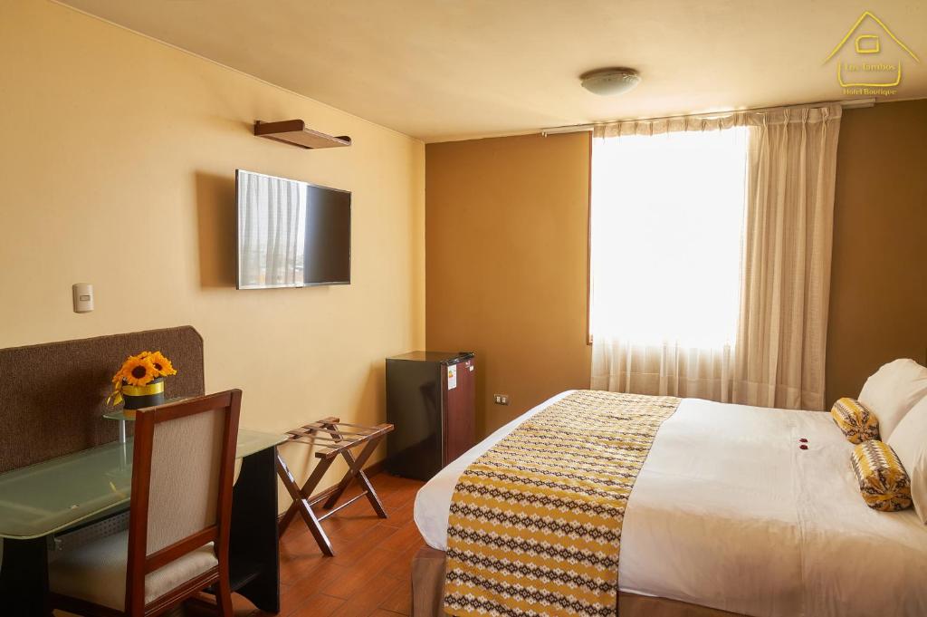 Postel nebo postele na pokoji v ubytování Hotel Los Tambos Boutique
