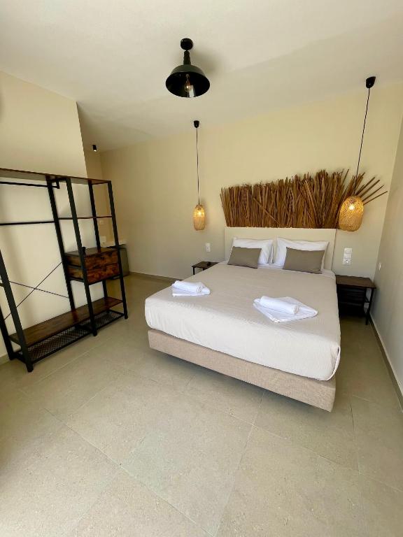 Postel nebo postele na pokoji v ubytování Atma Beach Rooms & Suites