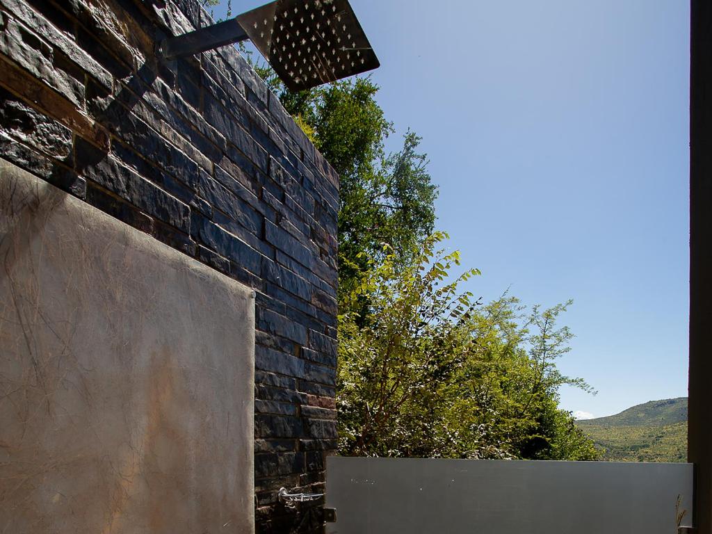 a brick wall with a light on top of it at Shepherds Tree Game Reserve in Pilanesberg