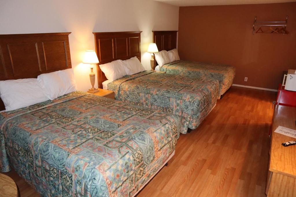Postel nebo postele na pokoji v ubytování Silver Sands Motel