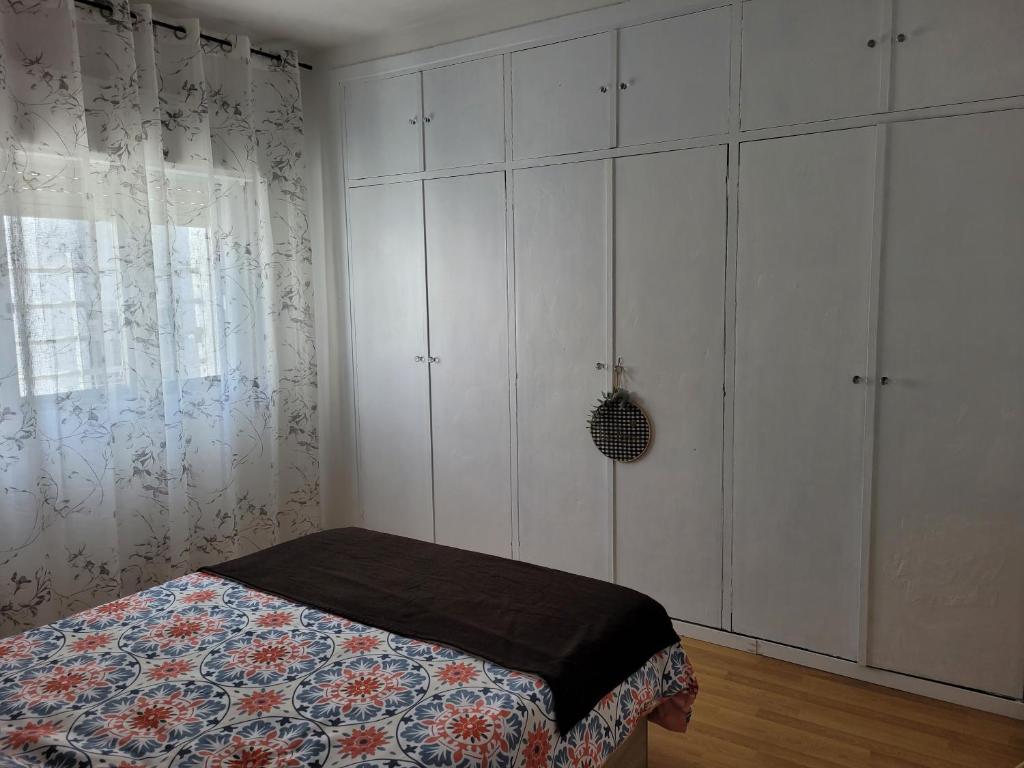A bed or beds in a room at Piso Stylety Alcazar