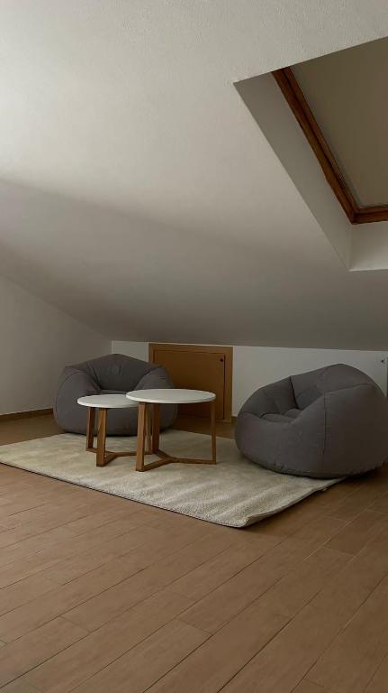 a living room with a table and a couch at Appartamento Palazzo dei Duchi in Avigliana