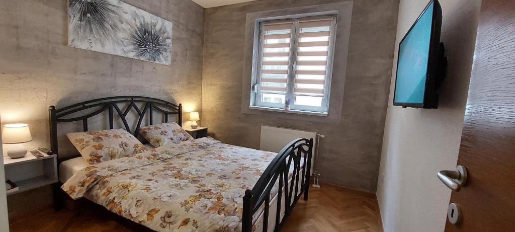 Postel nebo postele na pokoji v ubytování Apartman Lora