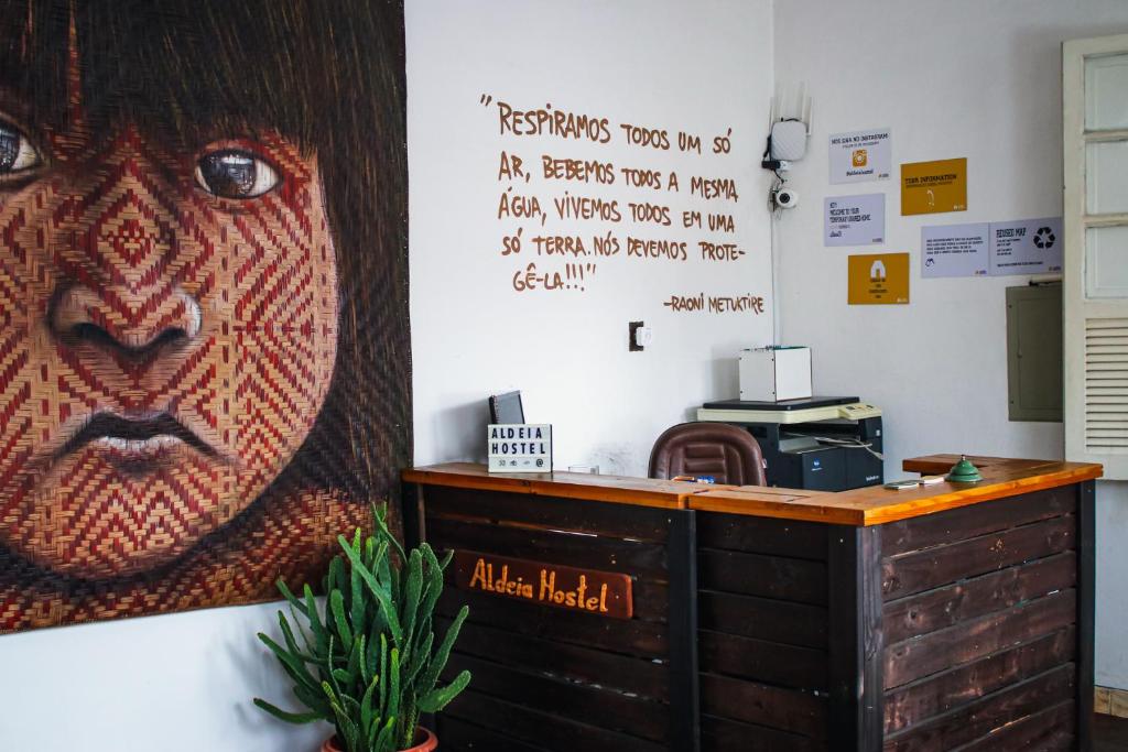 an office with a large picture of a monkey on the wall at Aldeia Hostel in Manaus