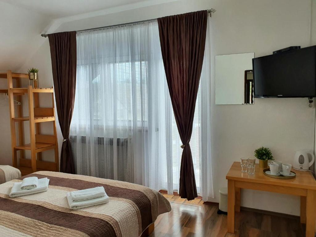 Postel nebo postele na pokoji v ubytování Guesthouse Kovačević