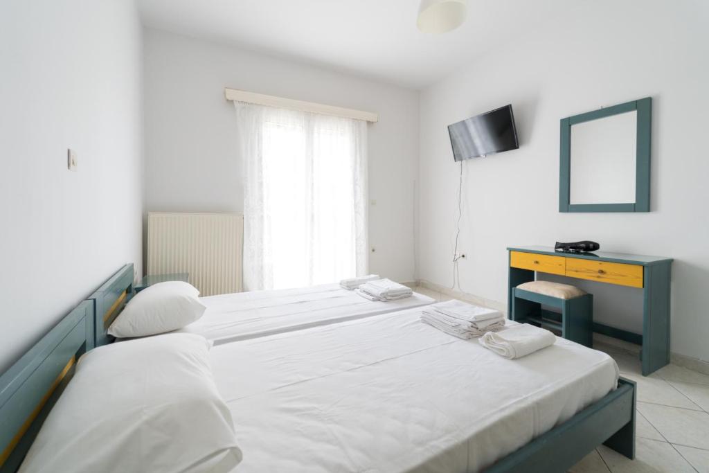 Postel nebo postele na pokoji v ubytování SPIROS HOME