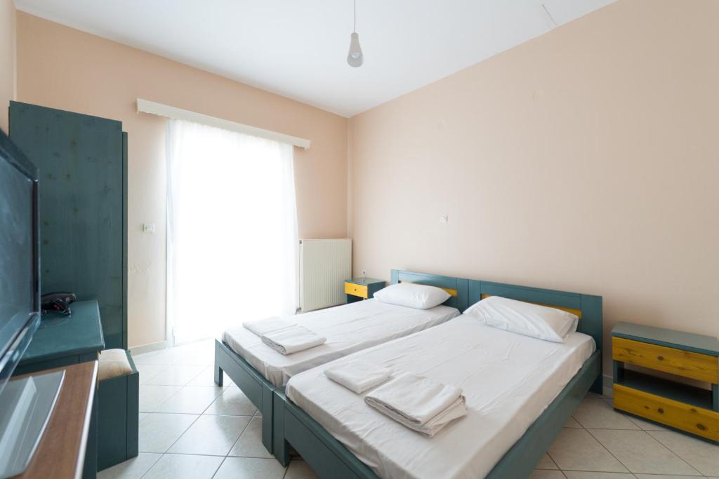 Postel nebo postele na pokoji v ubytování SPIROS HOME
