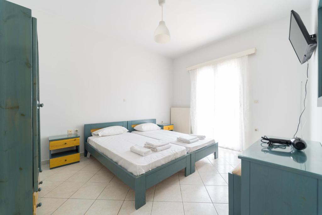 Postel nebo postele na pokoji v ubytování SPIROS HOME