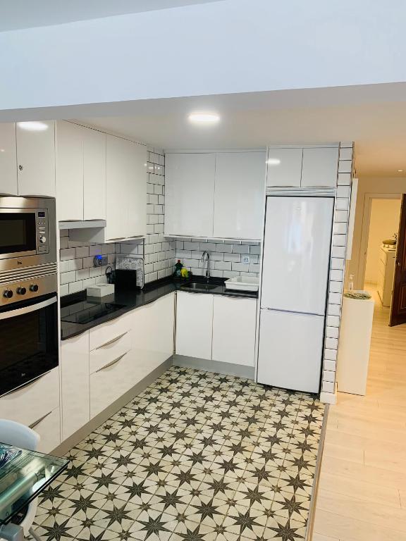 Kuchyň nebo kuchyňský kout v ubytování Casa Centro Benidorm