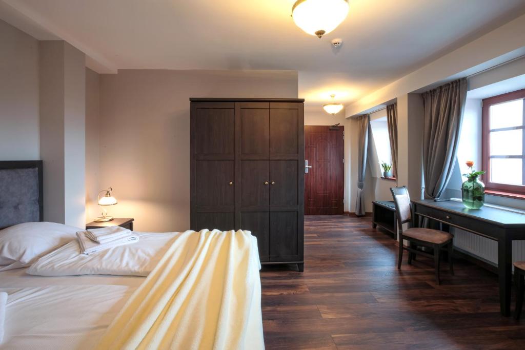 Postel nebo postele na pokoji v ubytování ZEPPELIN APARTMENTS Simple Acomodation
