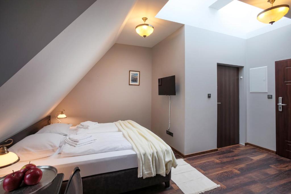 Postel nebo postele na pokoji v ubytování ZEPPELIN APARTMENTS Simple Acomodation