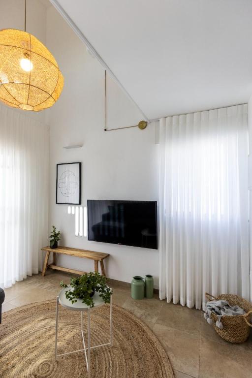 TV a/nebo společenská místnost v ubytování Gallerita