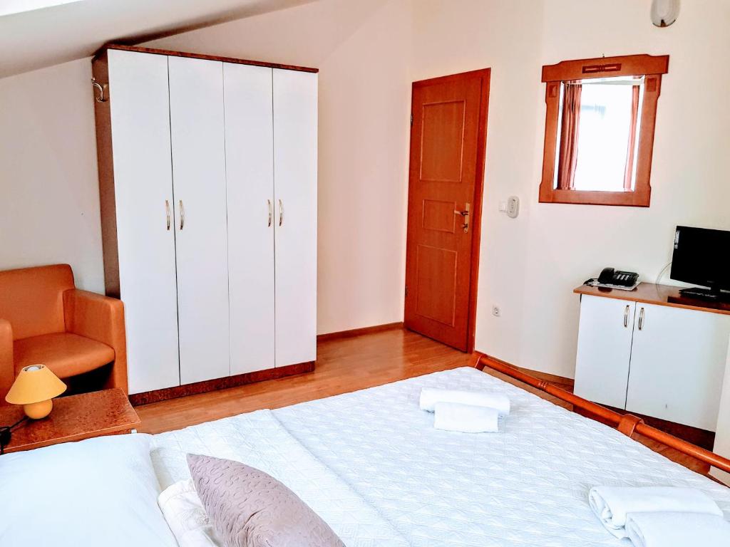 Postel nebo postele na pokoji v ubytování Villa Palčić