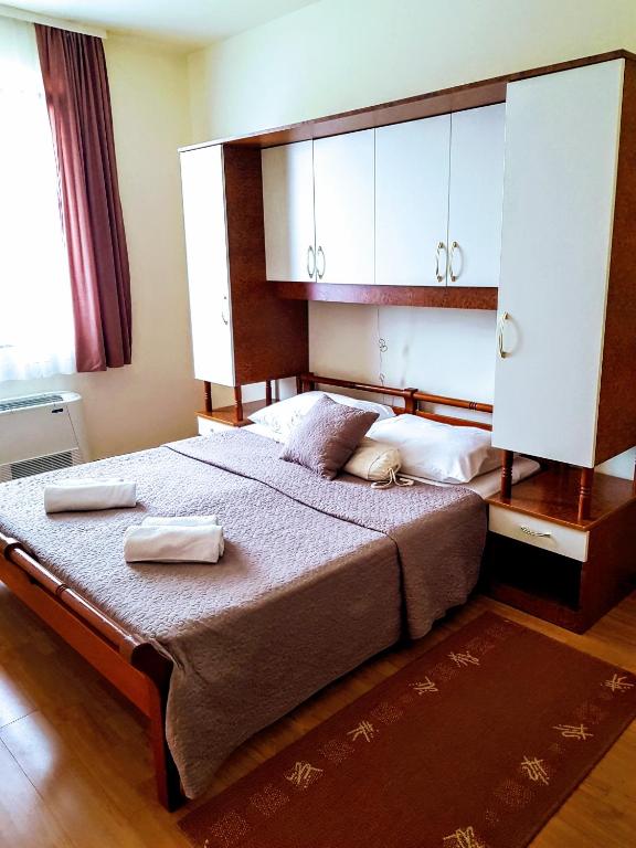 Postel nebo postele na pokoji v ubytování Villa Palčić