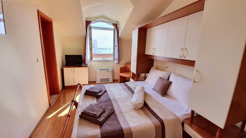 Postel nebo postele na pokoji v ubytování Villa Palčić