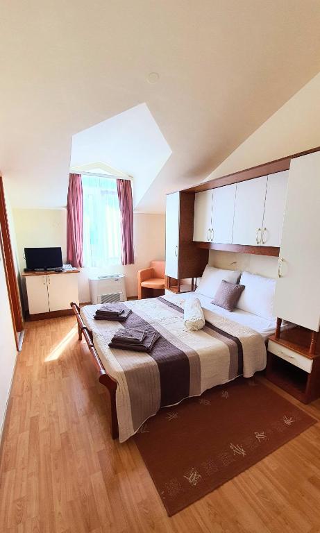 Postel nebo postele na pokoji v ubytování Villa Palčić