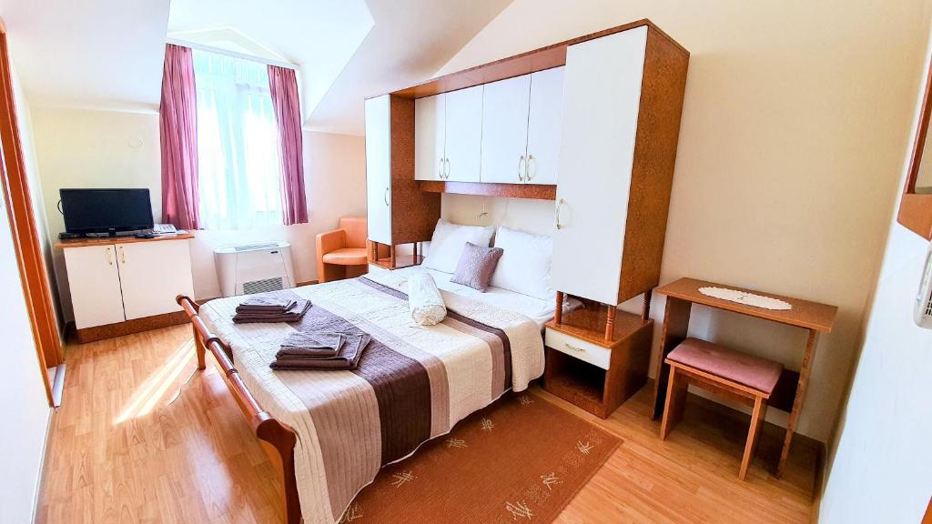 Postel nebo postele na pokoji v ubytování Villa Palčić