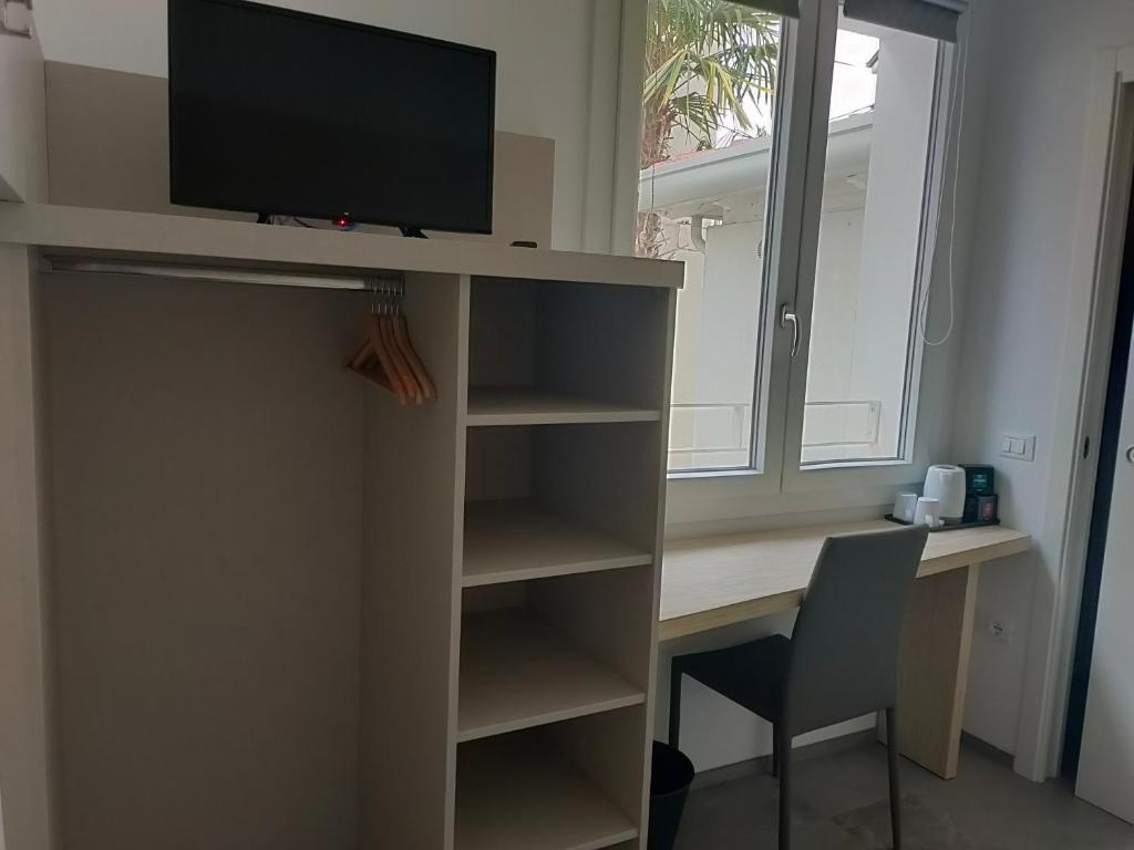 Televízia a/alebo spoločenská miestnosť v ubytovaní APFEL AR holiday-home