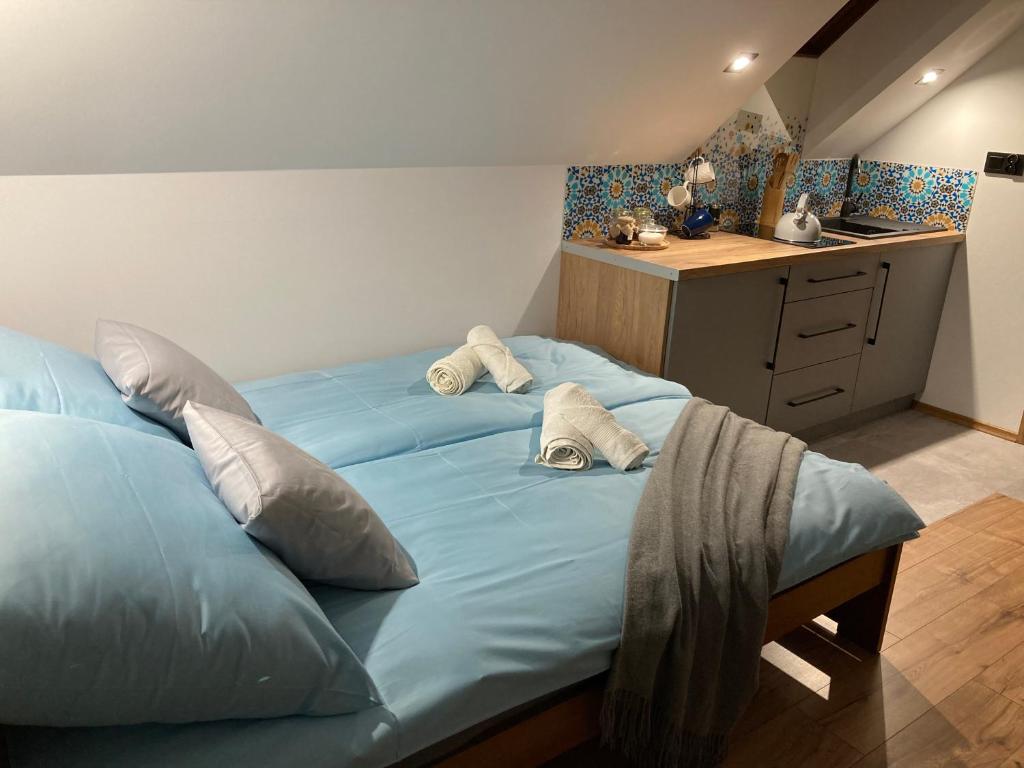Łóżko lub łóżka w pokoju w obiekcie Rezydencja pod Cergową Wellness & SPA
