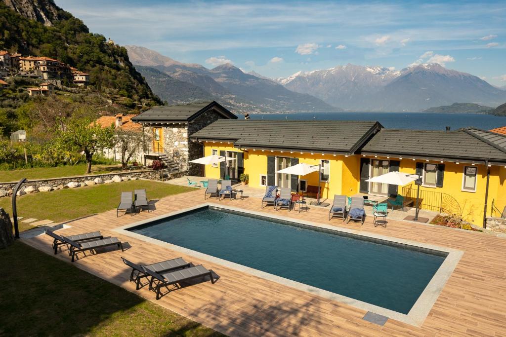 a villa with a swimming pool and a house at Agriturismo Il Medeghino in Musso