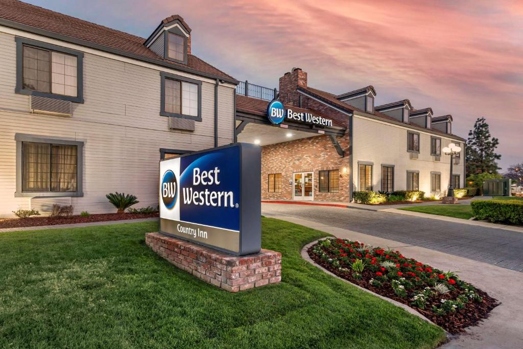 a best western sign in front of a building at Best Western Country Inn Temecula in Temecula