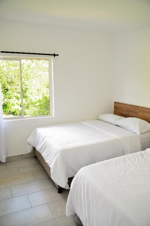 Cama o camas de una habitación en ORIGEN FINCA HOTEL