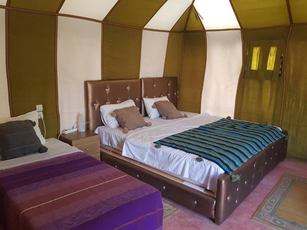 Postel nebo postele na pokoji v ubytování Merzouga Activities Camp