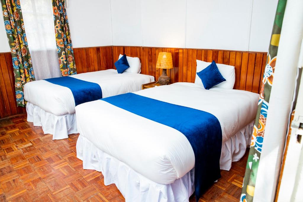 Voodi või voodid majutusasutuse Naro Moru River Lodge toas