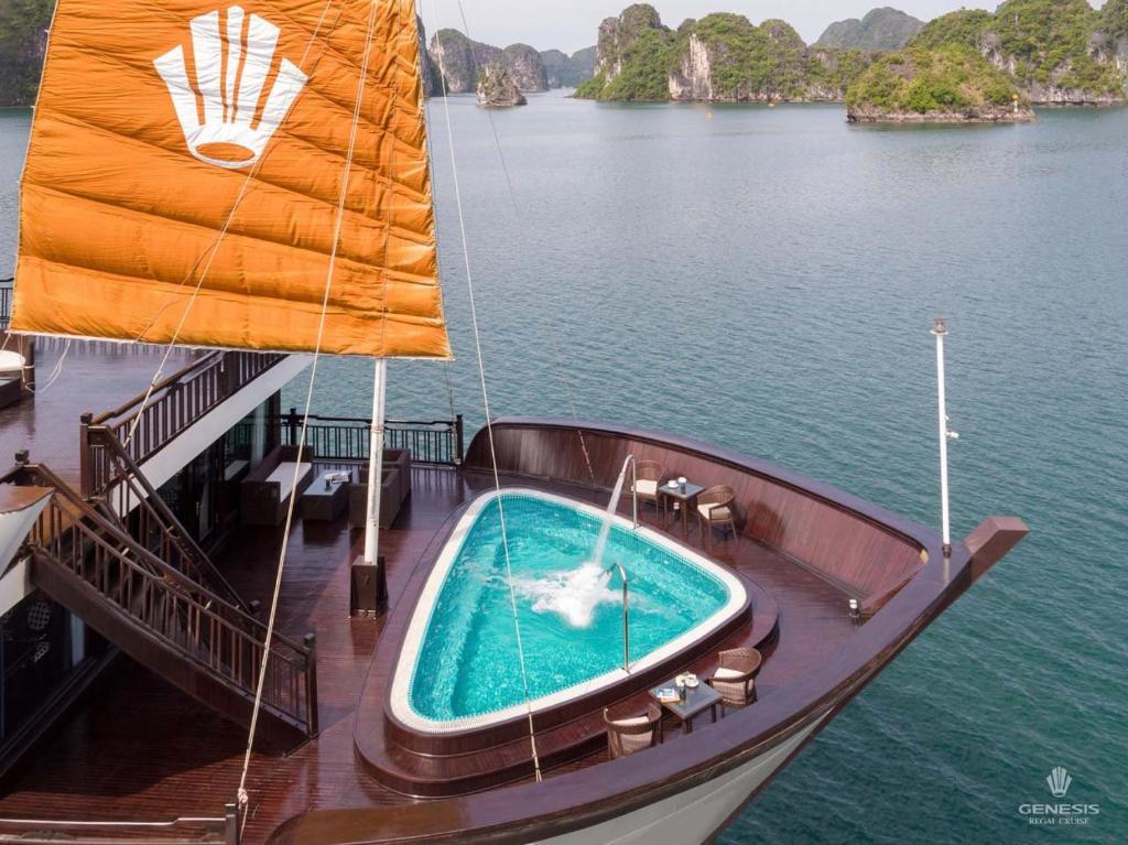 a swimming pool on a boat in the water at Genesis Luxury Regal Cruises in Ha Long
