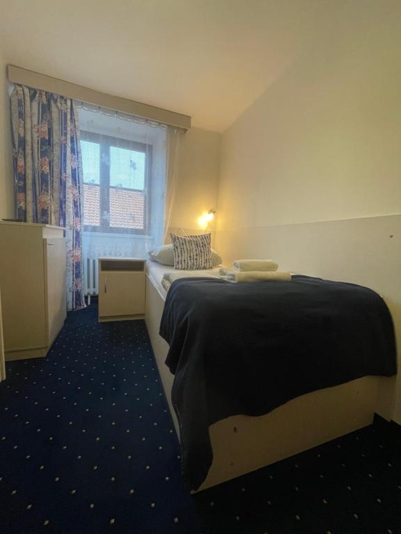 Postel nebo postele na pokoji v ubytování Hotel Gabreta