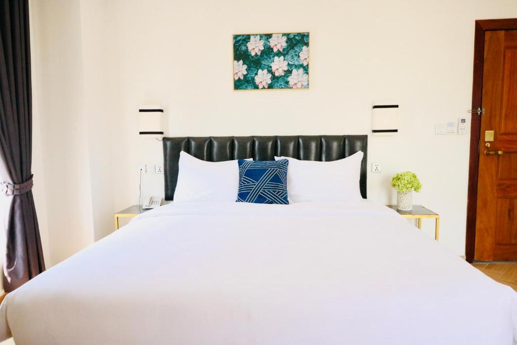 Un ou plusieurs lits dans un hébergement de l'établissement Mettavary Hotel