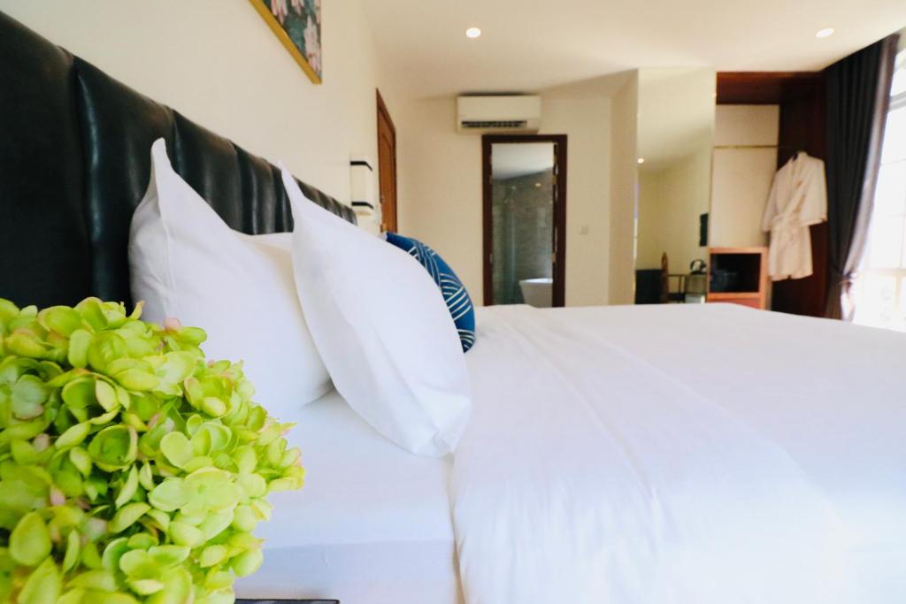 Un ou plusieurs lits dans un hébergement de l'établissement Mettavary Hotel