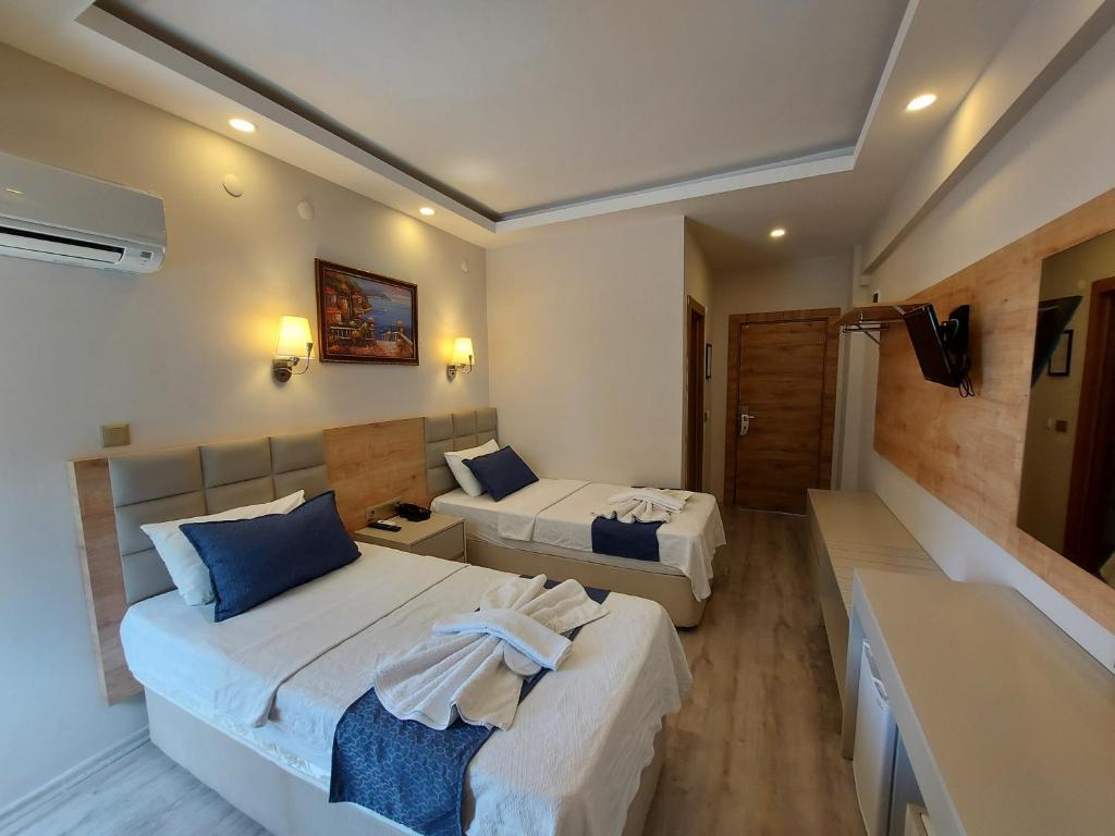 Postel nebo postele na pokoji v ubytování Afsin Hotel