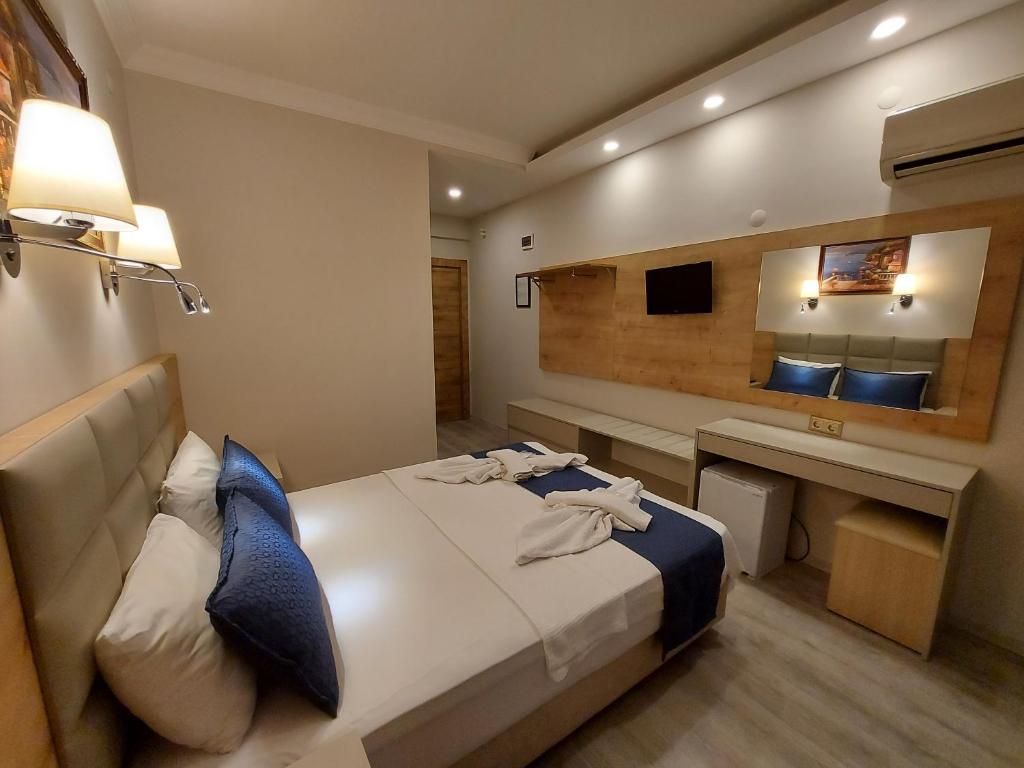 Postel nebo postele na pokoji v ubytování Afsin Hotel