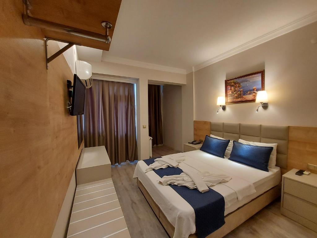 Postel nebo postele na pokoji v ubytování Afsin Hotel