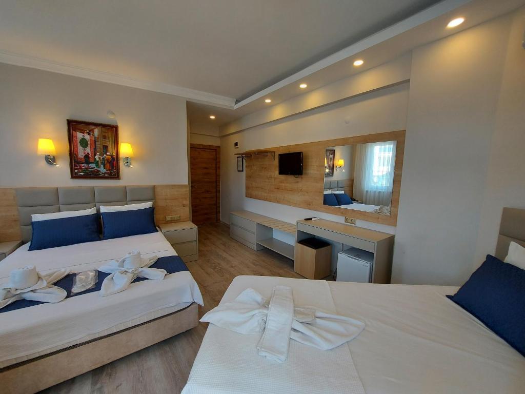Postel nebo postele na pokoji v ubytování Afsin Hotel