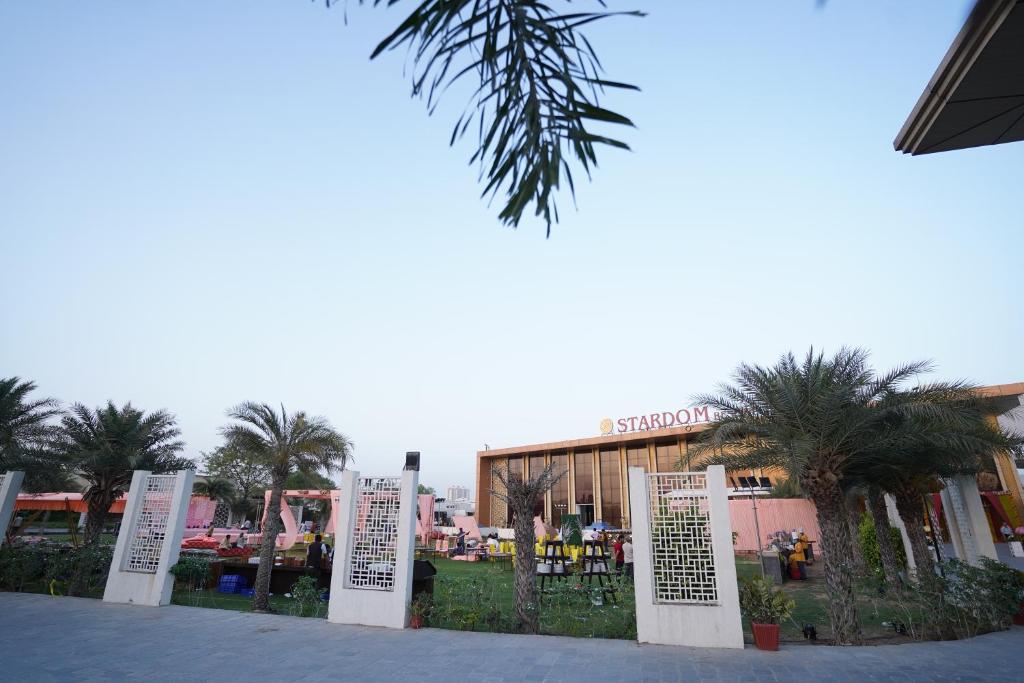a group of signs in front of a building at Stardom Resort Jaipur in Jaipur
