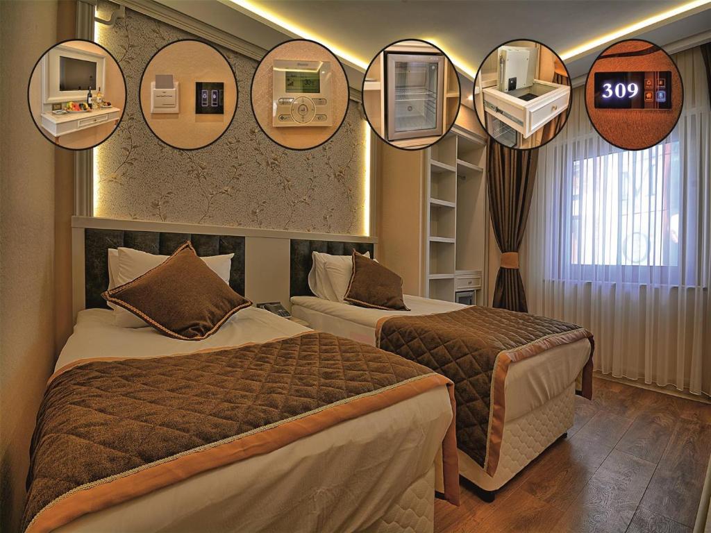 イスタンブールにあるサミル デラックス ホテルのベッド2台(壁に鏡付)