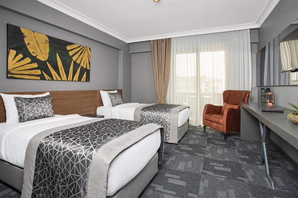 Postel nebo postele na pokoji v ubytování Luxon Hotel Sakarya