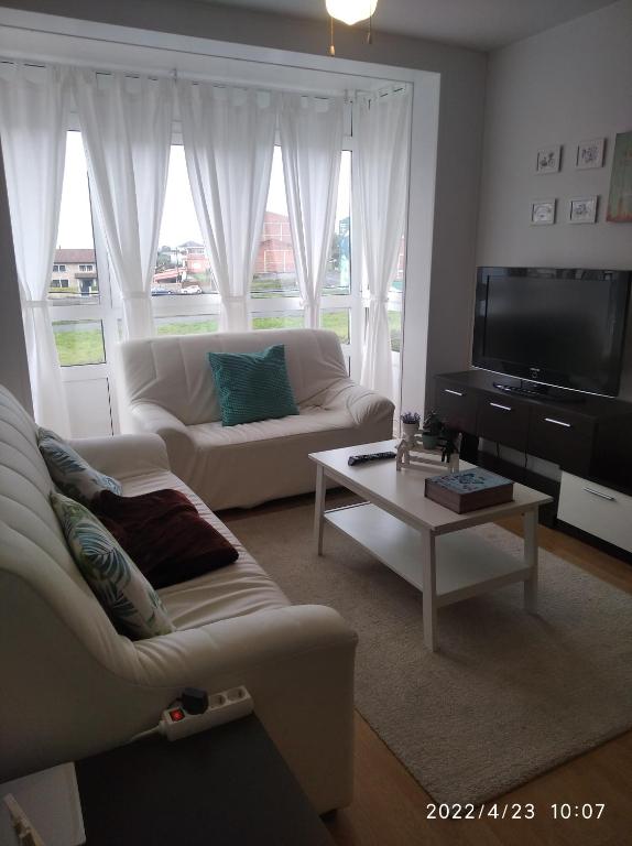 Televízia a/alebo spoločenská miestnosť v ubytovaní apartamento melide