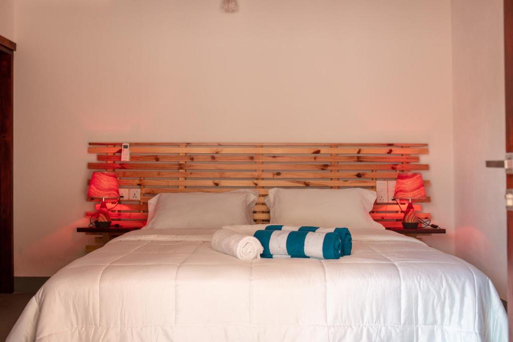 Postel nebo postele na pokoji v ubytování Vacanza Mathiveri