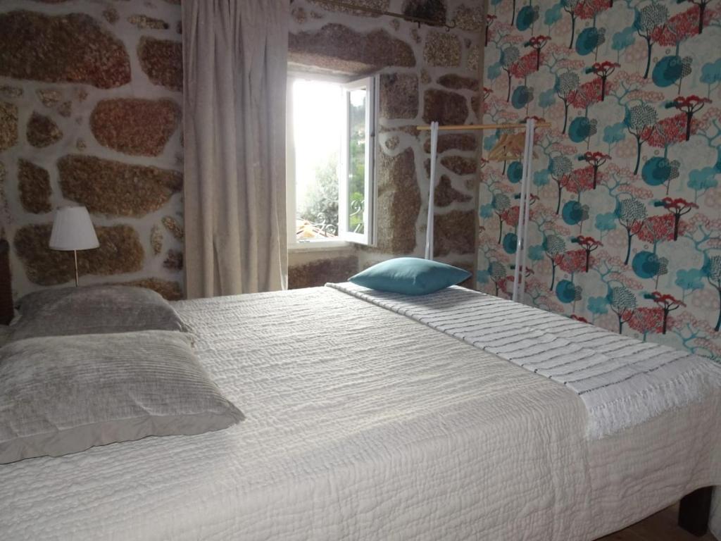 Postel nebo postele na pokoji v ubytování A CASA COM 2 PEREIRAS