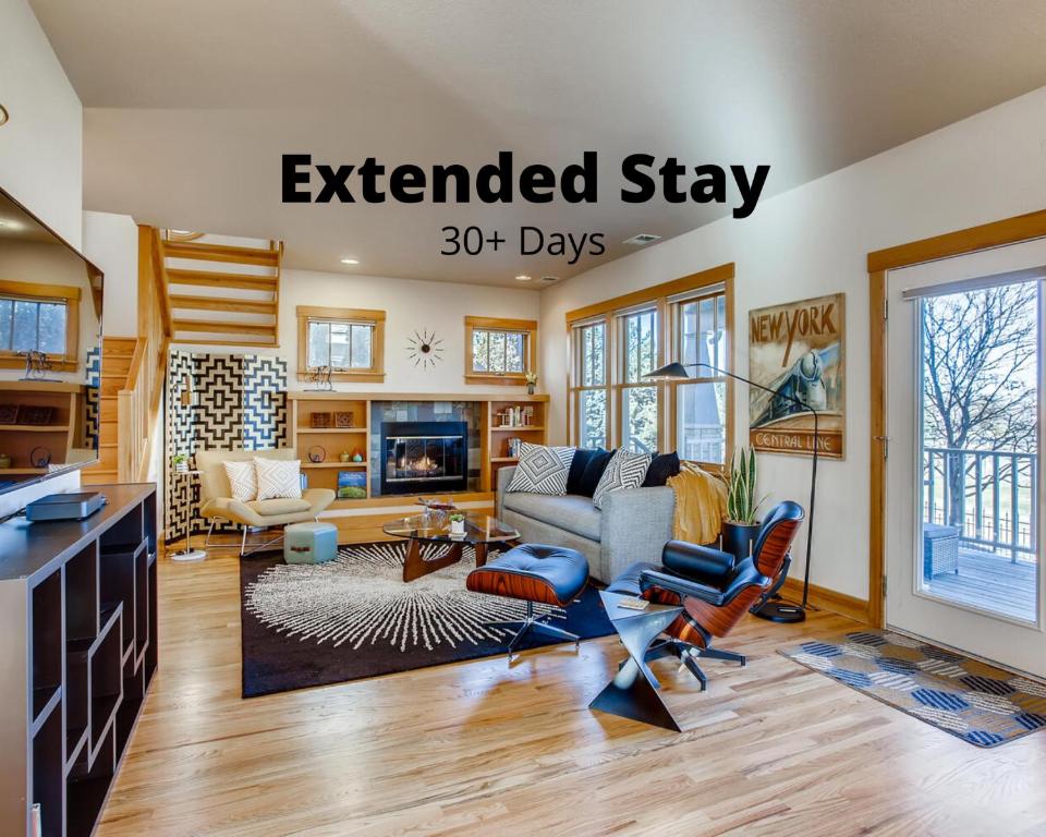 an extended stay days sign in a living room at Brilliant Posh Home - Backs to Poudre River Trail! in Fort Collins