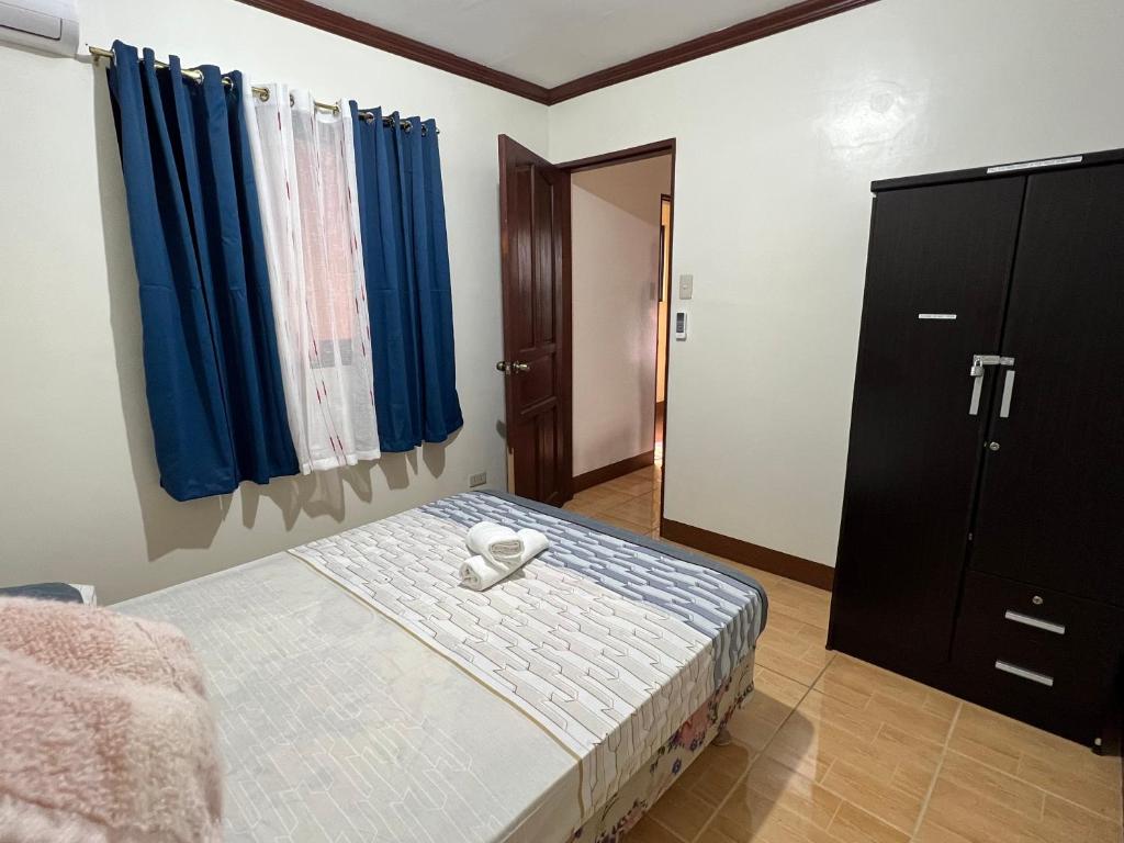 Postel nebo postele na pokoji v ubytování Affordable La Union