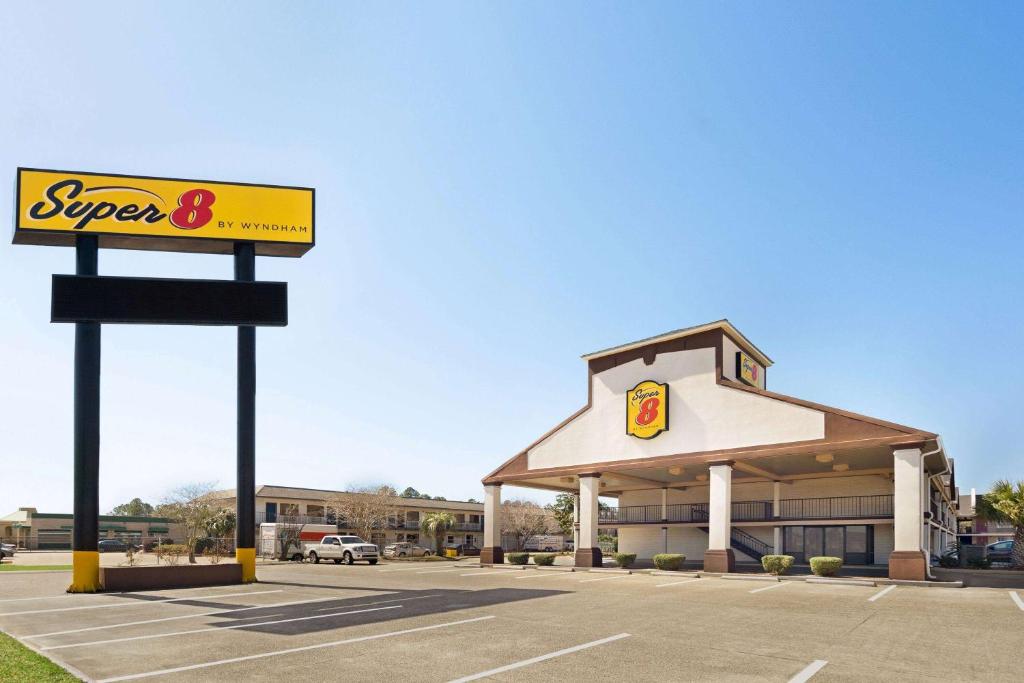 a supermarket with a sign in front of it at Super 8 by Wyndham Gulfport Biloxi Airport in Gulfport