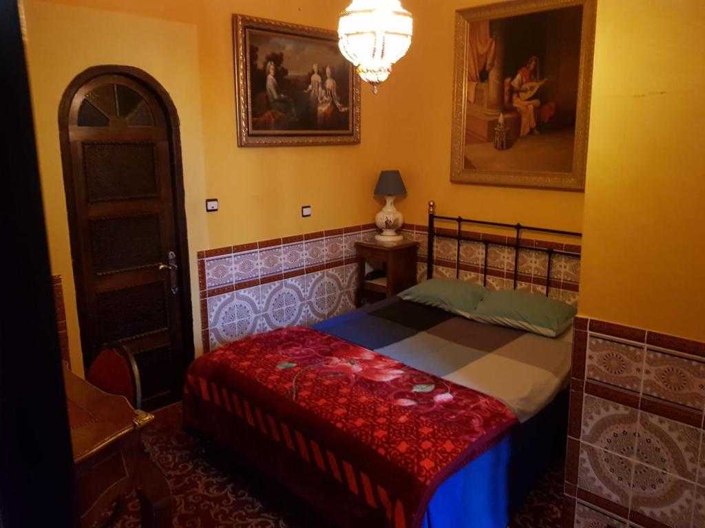 Postel nebo postele na pokoji v ubytování Hotel Mozart