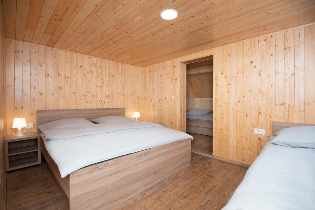 Postel nebo postele na pokoji v ubytování Zotlar House