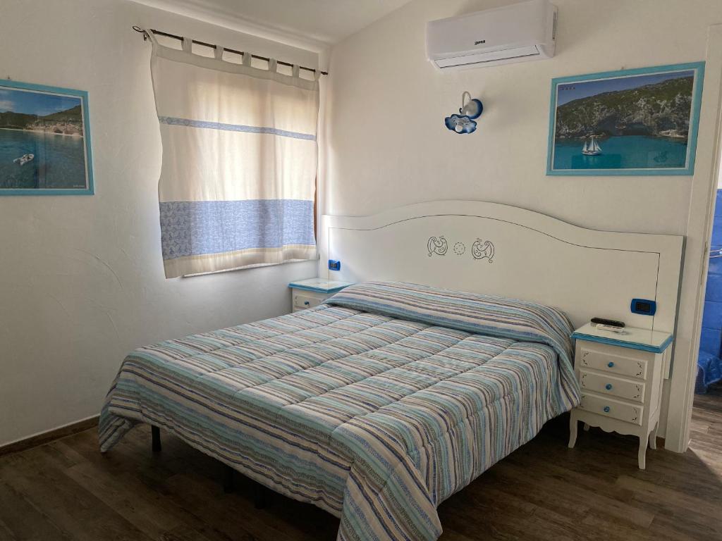 Postel nebo postele na pokoji v ubytování B&B da Miranna