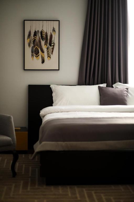 Postel nebo postele na pokoji v ubytování Triss Hotel
