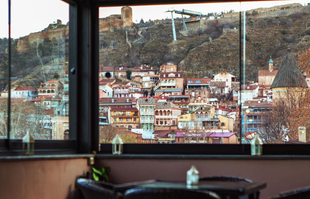 a view of a city from a window at Georgia Tbilisi GT Hotel in Tbilisi City